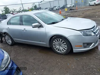 2011 Ford Fusion Hybrid with VIN 3FADP0L33BR126557, listed as a IAAI auction lot 42523235 with 179,867 mi miles and . Bid and sale history available at DreamBid. Image 13.