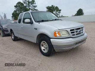 2002 Ford F-150 XL with VIN 1FTRX17282NA84011, listed as a IAAI auction lot 41871210 with 1 mi miles. Bid and sale history available at carsss.com. Image 1.
