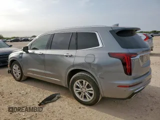 2024 Cadillac XT6 FWD Luxury with VIN 1GYKPAR41RZ700452, listed as a Copart auction lot 57675945 with 27,449 mi miles and Salvage title. Bid and sale history available at DreamBid. Image 2.