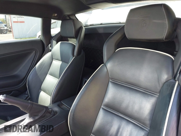 2009 Lamborghini Gallardo z VIN ZHWGU54T59LA07777, wystawiony jako IAAI lot #39749159 z przebiegiem 8730 mil mil oraz . Historia ofert i sprzedaży dostępna na DreamBid. Obrazek 8.