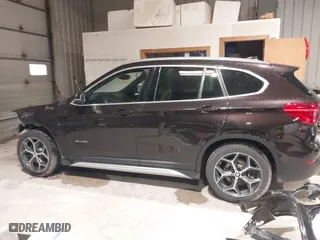 2016 BMW X1 xDrive28i with VIN WBXHT3C33GP886935, listed as a IAAI auction lot 41707367 with 73,201 mi miles. Bid and sale history available at carsss.com. Image 15.