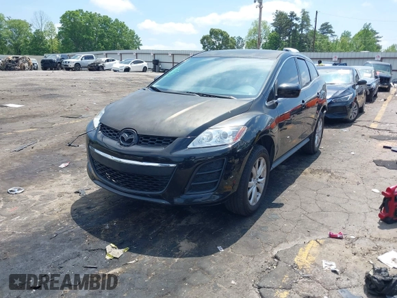 2010 Mazda CX-7 Touring z VIN JM3ER2W30A0341657, wystawiony jako IAAI lot #42123453 z przebiegiem 173 135 mil mil oraz . Historia ofert i sprzedaży dostępna na DreamBid. Obrazek 2.