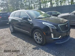 2021 Cadillac XT5 AWD Premium Luxury z VIN 1GYKNDRS8MZ217572, wystawiony jako IAAI lot #42190571 z przebiegiem 25 100 mil mil oraz . Historia ofert i sprzedaży dostępna na DreamBid. Obrazek 1.