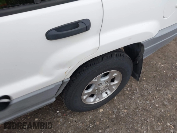 2000 Jeep Grand Cherokee Laredo z VIN 1J4GW48S2YC390226, wystawiony jako IAAI lot #42326715 z przebiegiem 273 806 mil mil oraz . Historia ofert i sprzedaży dostępna na DreamBid. Obrazek 6.