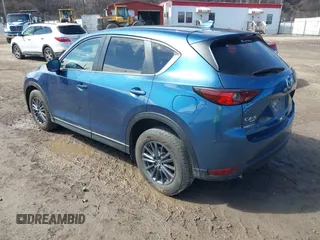 2021 Mazda CX-5 Touring with VIN JM3KFBCM4M0404093, listed as a IAAI auction lot 41751343 with 50,536 mi miles. Bid and sale history available at carsss.com. Image 3.