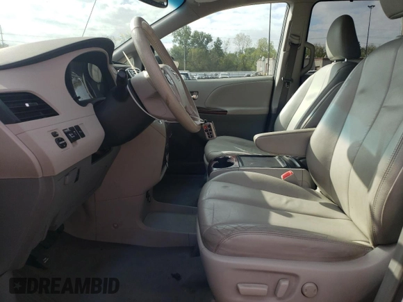 2012 Toyota Sienna XLE AAS with VIN 5TDYK3DC0CS250830, listed as a Copart auction lot 73323284 with 147,580 mi miles and Salvage Title. Bid and sale history available at DreamBid. Image 7.