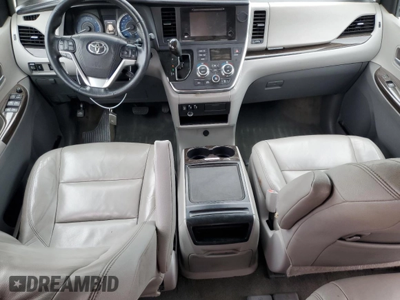 2015 Toyota Sienna XLE с VIN 5TDYK3DC7FS571431, выставлен на аукционе Copart как лот 57173595 с пробегом 305 940 миль миль и Списание • Salvage title. История ставок и продаж доступна на DreamBid. Изображение 8.