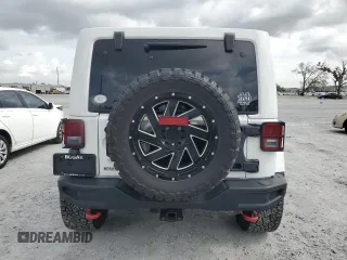 2017 Jeep Wrangler Unlimited Rubicon z VIN 1C4HJWFG6HL692928, wystawiony jako Copart lot #60049775 z przebiegiem 145 033 mil mil oraz Nie do naprawy • Non repairable. Historia ofert i sprzedaży dostępna na DreamBid. Obrazek 6.