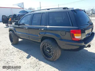 2002 Jeep Grand Cherokee Limited with VIN 1J4GW58N62C308103, listed as a IAAI auction lot 41760396 with 247,152 mi miles. Bid and sale history available at carsss.com. Image 3.