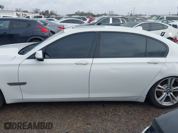 2015 BMW 7 Series 740Li with VIN WBAYE4C54FD947205, listed as a IAAI auction lot 41566291 with 172,729 mi miles and . Bid and sale history available at DreamBid. Image 14.
