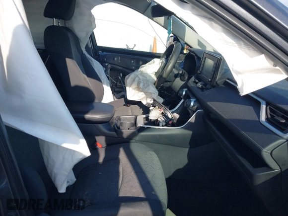 2020 Toyota RAV4 XLE with VIN 2T3P1RFV2LW130185, listed as a IAAI auction lot 42033372 with 98,667 mi miles and . Bid and sale history available at DreamBid. Image 5.