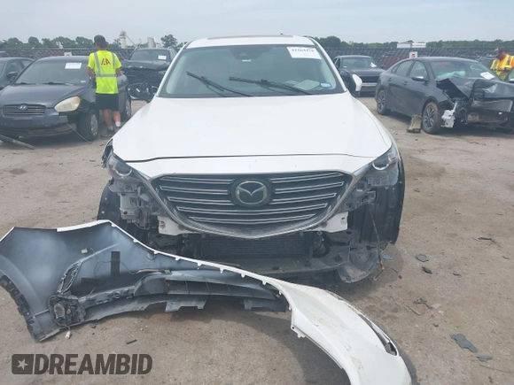 2021 Mazda CX-9 Touring with VIN JM3TCACY9M0526376, listed as a IAAI auction lot 42264478 with 74,671 mi miles and . Bid and sale history available at DreamBid. Image 6.