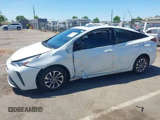 2019 Toyota Prius L Eco z VIN JTDKARFU5K3089070, wystawiony jako IAAI lot #42302536 z przebiegiem 122 911 mil mil oraz . Historia ofert i sprzedaży dostępna na DreamBid. Obrazek 6.