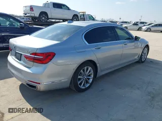 2016 BMW 7 Series 740i with VIN WBA7E2C5XGG739099, listed as a IAAI auction lot 41526038 with 123,900 mi miles. Bid and sale history available at carsss.com. Image 4.