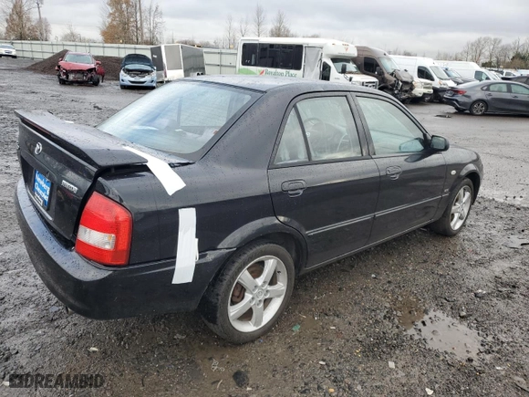 2003 Mazda Protege DX with VIN JM1BJ225331210519, listed as a Copart auction lot 86648884 with 84,258 mi miles and Salvage Title. Bid and sale history available at carsss.com. Image 3.
