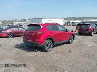 2016 Mazda CX-5 Grand Touring with VIN JM3KE4DY9G0850583, listed as a IAAI auction lot 42075545 with 92,789 mi miles and . Bid and sale history available at carsss.com. Image 4.