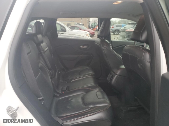 2015 Jeep Cherokee Trailhawk with VIN 1C4PJMBS9FW698857, listed as a Copart auction lot 86572504 with 143,919 mi miles and Clean Title. Bid and sale history available at carsss.com. Image 10.
