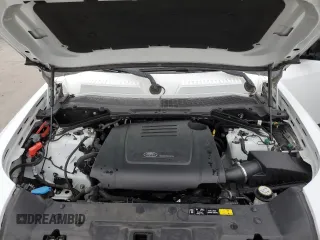 2021 Land Rover Defender S with VIN SALEJ7RX9M2038129, listed as a Copart auction lot 83840574 with 88,105 mi miles and Salvage title. Bid and sale history available at DreamBid. Image 12.