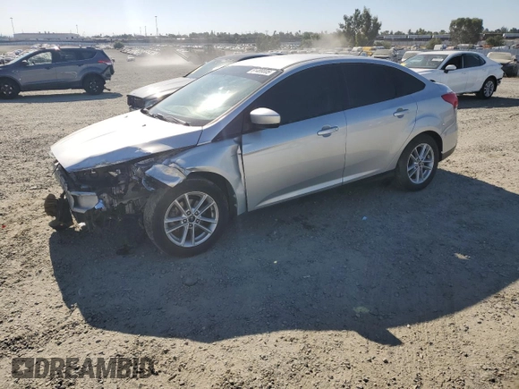 2018 Ford Focus SE with VIN 1FADP3FE4JL308909, listed as a Copart auction lot 61489005 with 58,613 mi miles and Salvage title. Bid and sale history available at DreamBid. Image 1.
