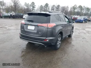 2018 Toyota RAV4 XLE with VIN 2T3RFREV5JW798328, listed as a IAAI auction lot 41868104 with 61,076 mi miles. Bid and sale history available at carsss.com. Image 4.