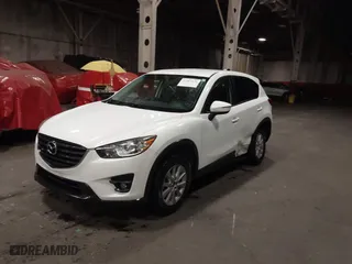 2016 Mazda CX-5 Touring with VIN JM3KE4CY0G0853261, listed as a IAAI auction lot 41861176 with 63,491 mi miles. Bid and sale history available at carsss.com. Image 17.