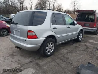 1999 Mercedes-Benz M-Class with VIN 4JGAB72E4XA113675, listed as a IAAI auction lot 41554604 with 230,092 mi miles. Bid and sale history available at carsss.com. Image 4.