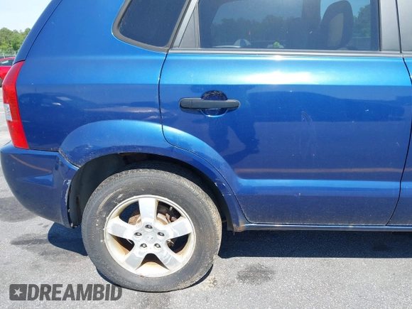 2005 Hyundai Tucson GL with VIN KM8JM12B85U233228, listed as a IAAI auction lot 42051627 with 170,742 mi miles. Bid and sale history available at carsss.com. Image 13.