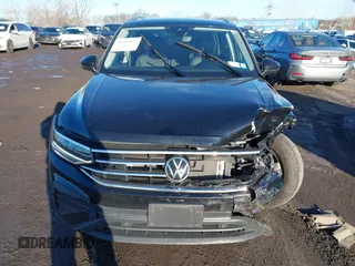 2023 Volkswagen Tiguan SE with VIN 3VVMB7AX8PM032557, listed as a IAAI auction lot 41585975 with 28,706 mi miles and . Bid and sale history available at DreamBid. Image 12.