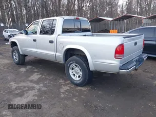 2002 Dodge Dakota Sport with VIN 1B7HG38N12S661043, listed as a IAAI auction lot 41552725 with 206,662 mi miles. Bid and sale history available at carsss.com. Image 3.