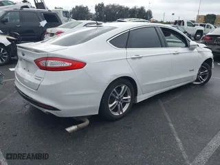 2015 Ford Fusion Titanium Hybrid with VIN 3FA6P0RU3FR247118, listed as a IAAI auction lot 41210219 with 143,348 mi miles. Bid and sale history available at carsss.com. Image 4.