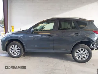 2016 Mazda CX-5 Touring with VIN JM3KE4CY4G0779827, listed as a IAAI auction lot 41840727 with 91,367 mi miles. Bid and sale history available at carsss.com. Image 15.