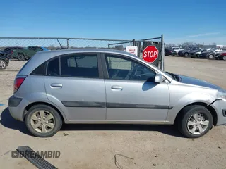 2009 Kia Rio LX with VIN KNADE243596530314, listed as a IAAI auction lot 41681050 with 114,831 mi miles. Bid and sale history available at carsss.com. Image 13.