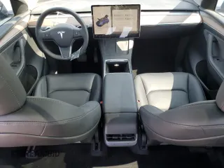 2024 Tesla Model Y with VIN 7SAYGDED0RF102479, listed as a Copart auction lot 55431975 with 23,989 mi miles and Salvage title. Bid and sale history available at DreamBid. Image 8.