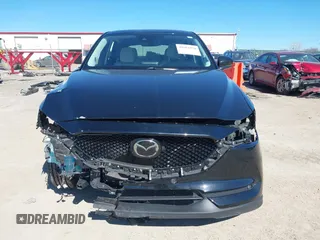 2020 Mazda CX-5 Grand Touring with VIN JM3KFBDMXL0763316, listed as a IAAI auction lot 41661958 with 64,881 mi miles and . Bid and sale history available at carsss.com. Image 13.