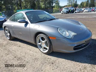 2004 Porsche 911 Carrera z VIN WP0AA29994S621164, wystawiony jako IAAI lot #42022378 z przebiegiem 83 804 mil mil oraz . Historia ofert i sprzedaży dostępna na DreamBid. Obrazek 1.