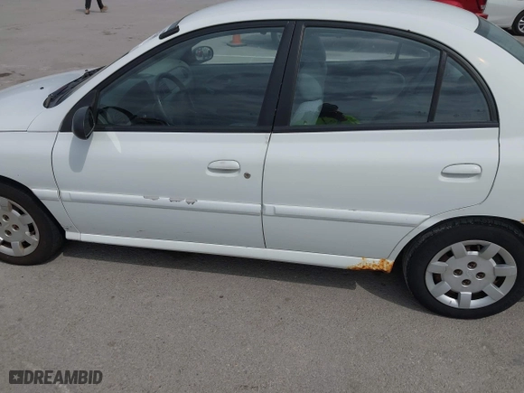 2002 Kia Rio with VIN KNADC123926185376, listed as a IAAI auction lot 42027348 with 84,893 mi miles. Bid and sale history available at carsss.com. Image 12.