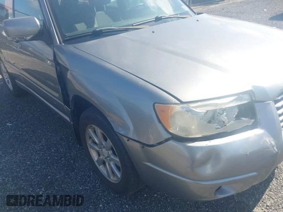 2007 Subaru Forester X z VIN JF1SG65677H740067, wystawiony jako IAAI lot #42294046 z przebiegiem 182 812 mil mil oraz . Historia ofert i sprzedaży dostępna na DreamBid. Obrazek 14.