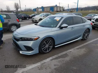 2022 Honda Civic Sedan Touring with VIN 2HGFE1F99NH306559, listed as a IAAI auction lot 41208480 with 18,956 mi miles. Bid and sale history available at carsss.com. Image 2.
