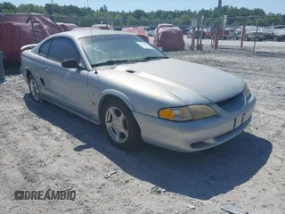 1995 Ford Mustang with VIN 1FALP4047SF170414, listed as a IAAI auction lot 42079990 with 106,398 mi miles. Bid and sale history available at carsss.com. Image 1.