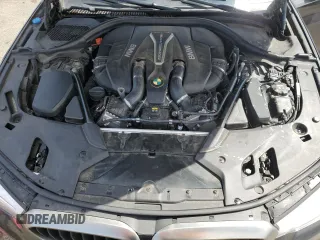 2018 BMW 5 Series M550i xDrive with VIN WBAJB9C57JB286734, listed as a Copart auction lot 52711235 with 127,450 mi miles and Salvage title. Bid and sale history available at DreamBid. Image 11.