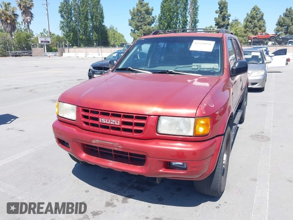 1999 Isuzu Rodeo S z VIN 4S2CK58WXX4346156, wystawiony jako IAAI lot #42328951 z przebiegiem 196 182 mil mil oraz . Historia ofert i sprzedaży dostępna na DreamBid. Obrazek 6.
