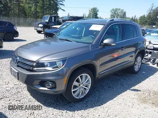 2013 Volkswagen Tiguan SEL with VIN WVGBV3AX1DW595673, listed as a IAAI auction lot 42140263 with 77,457 mi miles and . Bid and sale history available at DreamBid. Image 2.