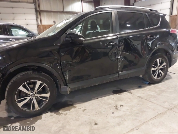 2017 Toyota RAV4 XLE with VIN 2T3RFREV0HW669312, listed as a IAAI auction lot 41410721 with 99,404 mi miles. Bid and sale history available at carsss.com. Image 6.