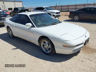1996 Ford Probe z VIN 1ZVLT22B0T5127219, wystawiony jako IAAI lot #42279311 z przebiegiem 123 290 mil mil oraz . Historia ofert i sprzedaży dostępna na DreamBid. Obrazek 1.