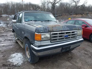 1987 Ford Bronco XL with VIN 1FMEU15N4HLA38776, listed as a IAAI auction lot 41767617 with 52,914 mi miles. Bid and sale history available at carsss.com. Image 1.