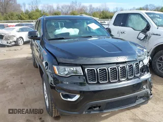 2018 Jeep Grand Cherokee Laredo E with VIN 1C4RJFAG1JC146927, listed as a IAAI auction lot 41887033 with 157,985 mi miles and . Bid and sale history available at DreamBid. Image 1.