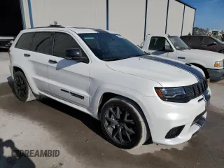 2019 Jeep Grand Cherokee Trackhawk with VIN 1C4RJFN92KC564748, listed as a Copart auction lot 82677504 with 48,528 mi miles and Salvage title. Bid and sale history available at DreamBid. Image 4.