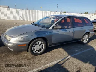 1997 Saturn SW z VIN 1G8ZK8279VZ169005, wystawiony jako Copart lot #73049694 z przebiegiem 110 215 mil mil oraz Szkody całkowita. Historia ofert i sprzedaży dostępna na DreamBid. Obrazek 1.