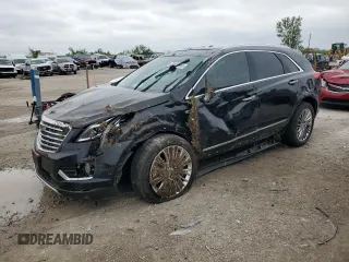 2017 Cadillac XT5 Platinum AWD with VIN 1GYKNFRS2HZ138657, listed as a Copart auction lot 54838965 with 79,000 mi miles and Salvage title. Bid and sale history available at DreamBid. Image 1.