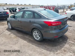 2016 Ford Focus SE with VIN 1FADP3F21GL387227, listed as a IAAI auction lot 42438650 with 59,969 mi miles and . Bid and sale history available at DreamBid. Image 3.